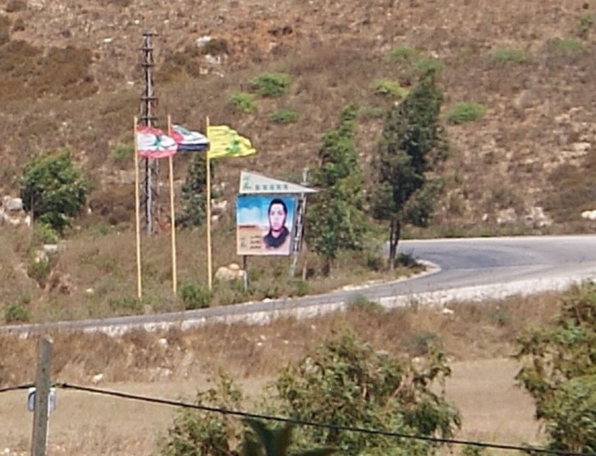 (Hezbollah flag and sign near Metula, Israel)(photo Hadar Sela)