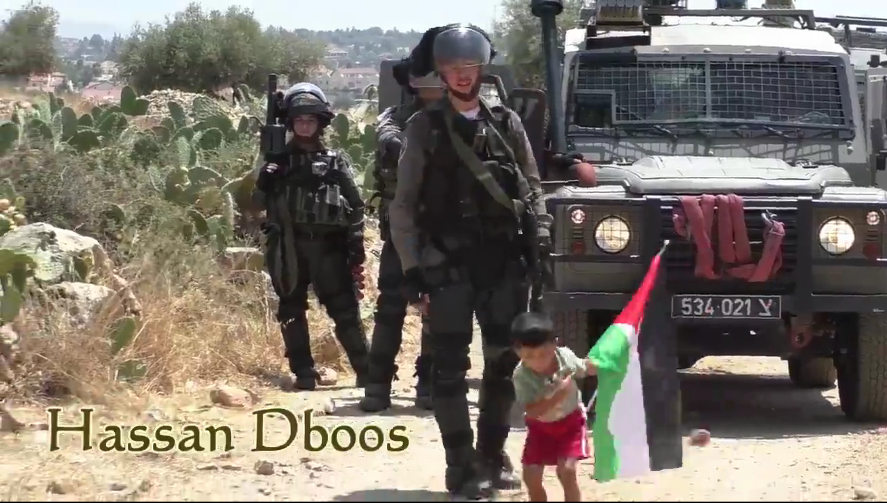 Palestinian child pushed towards soldier video screen shot tossing rock