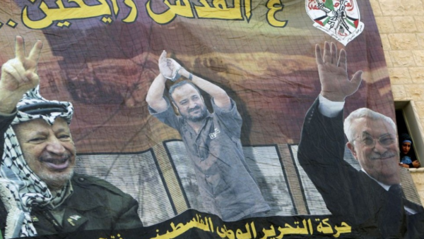 Poster at Al-Quds University | Jenin, West Bank | shows (left to right) Yasser Arafat, jailed Palestinian Marwan Barghouti, and Mahmoud Abbas | Reads: "Going to Jerusalem" | Credit: AP/Mohammad Ballas & Times of Israel